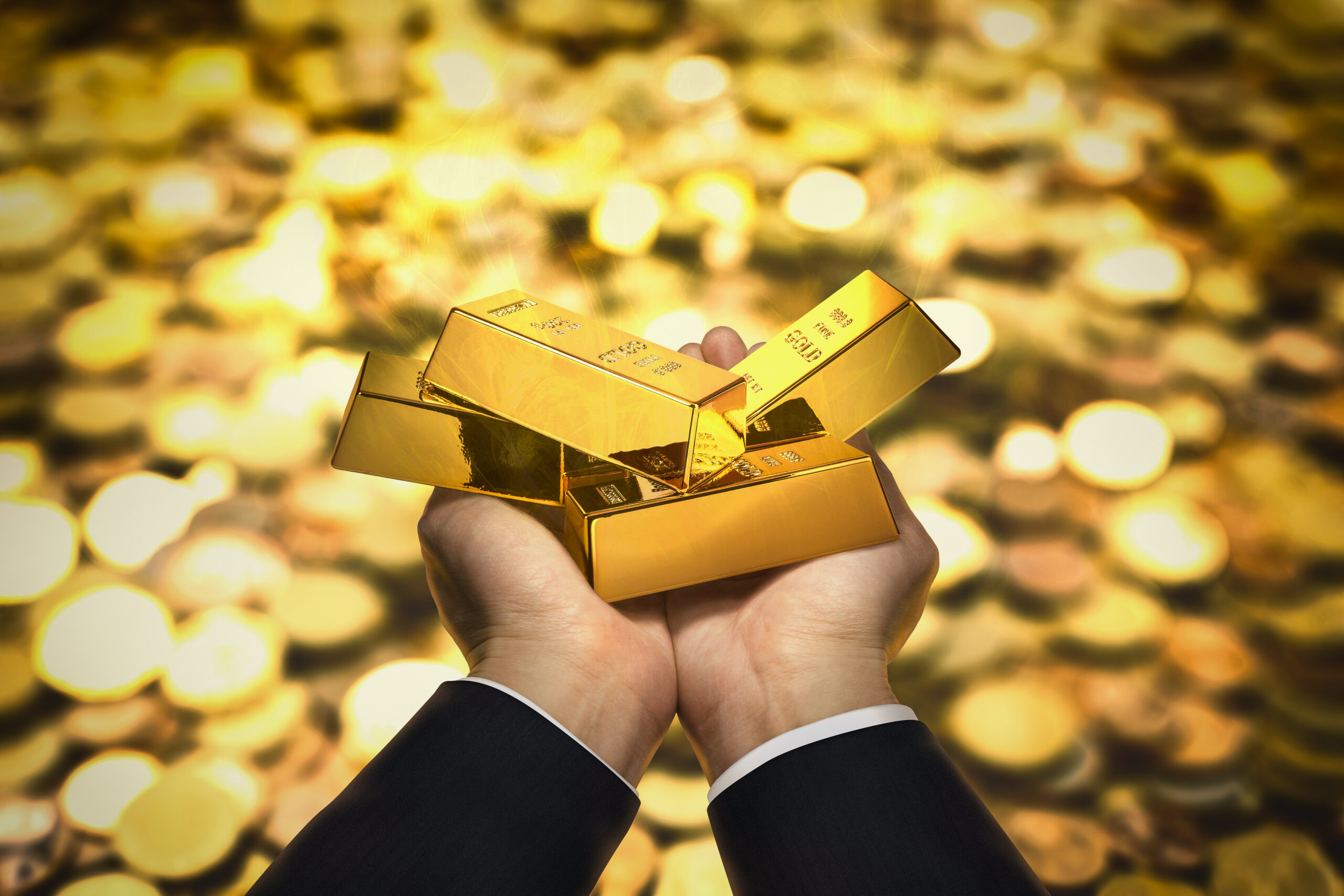 vecteezy_gold-bar-on-hand_3386359